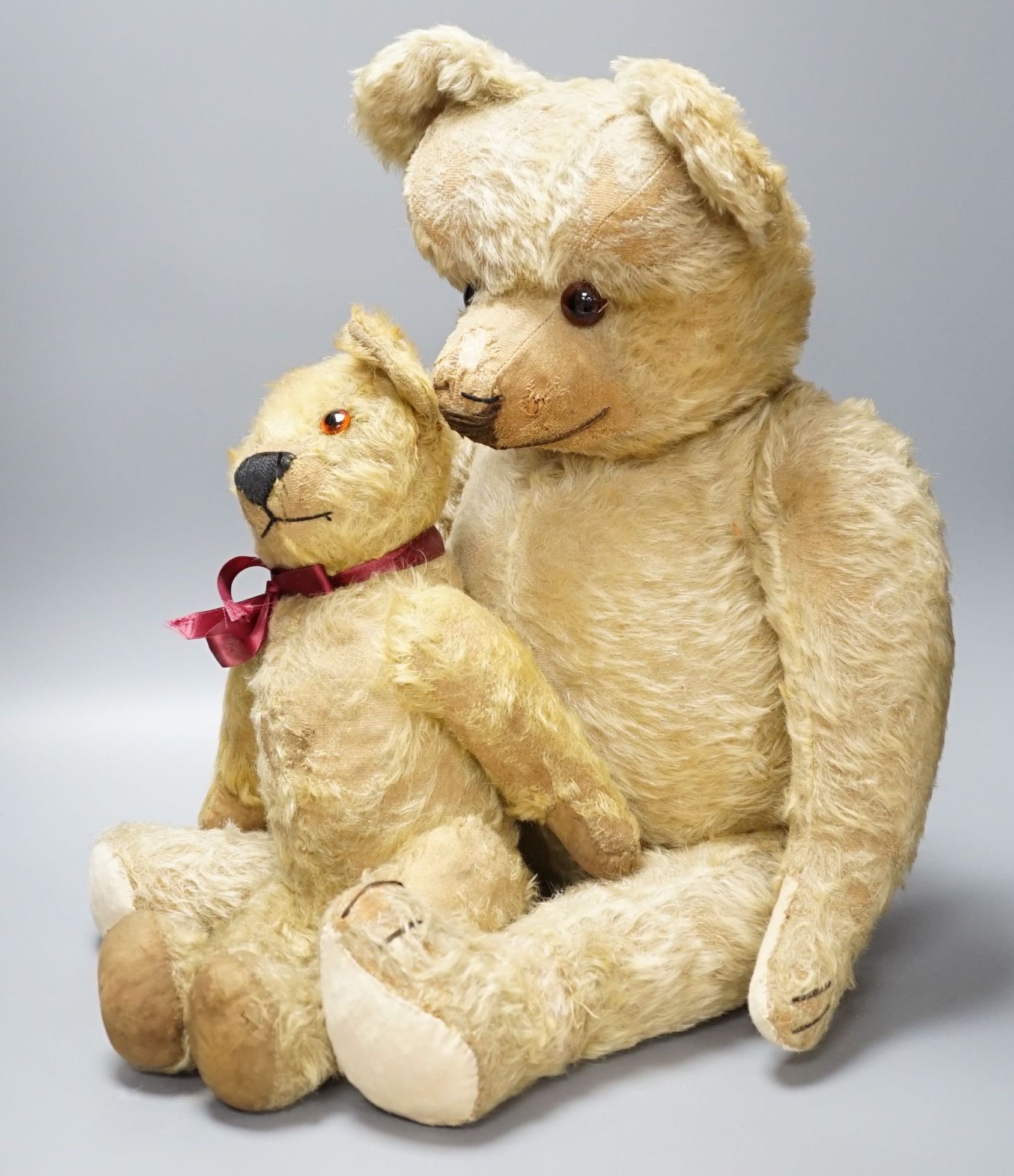A large 1920's Chad Valley Teddy bear, 75cm, together with another 1920's Chad Valley Teddy bear, play-worn